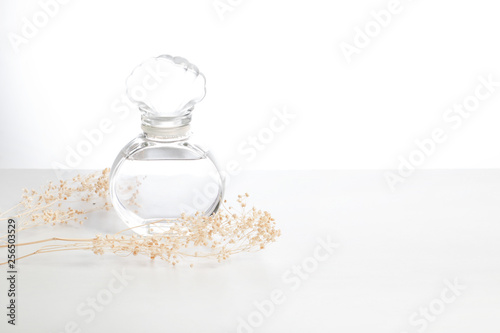 glass perfume fragrance aroma smell mockup product package with dried flower on white background, cosmetic bottle