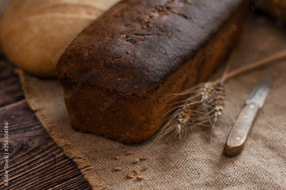 delicious, soft bakery products, appetizing baked in a rustic oven in vintage style on a wooden background.