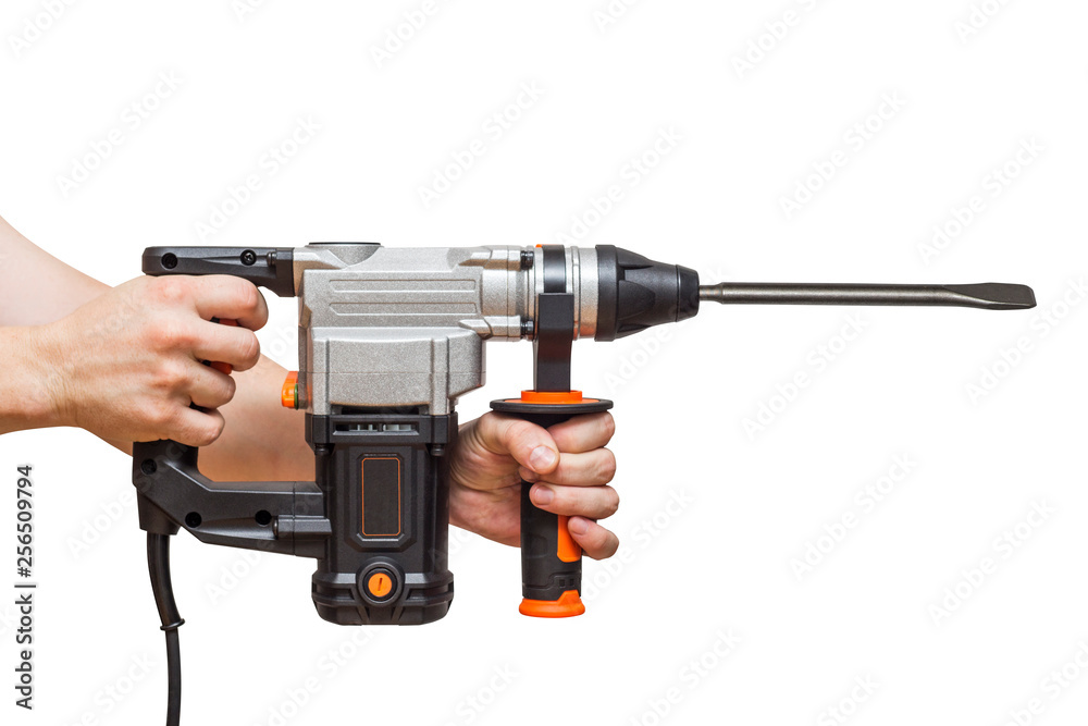 Perforator drill in the worker hand isolated on white background Perforator drill in the worker hand isolated on white background