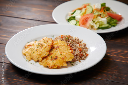 fried chicken breast with buckwheat and salad