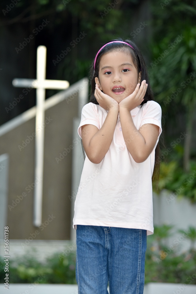 Surprised Filipina Child And Cross Surprised Filipina Child And Cross