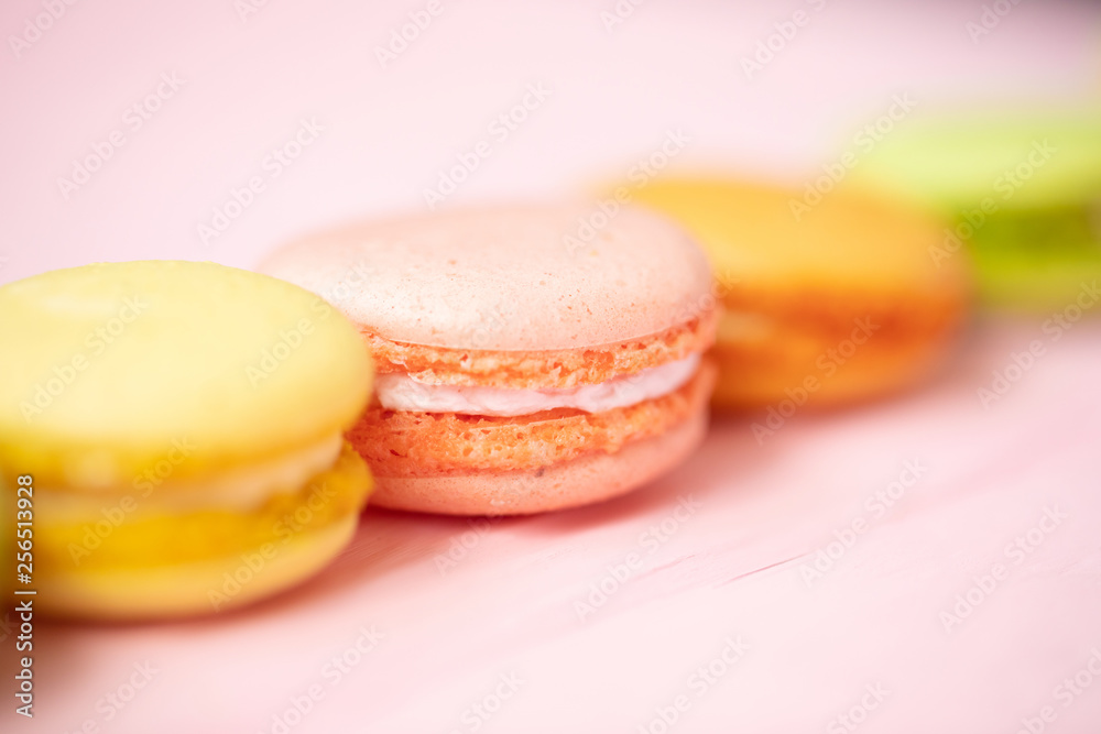 Multicolored macaroons on pink background. Multicolored macaroons on pink background.