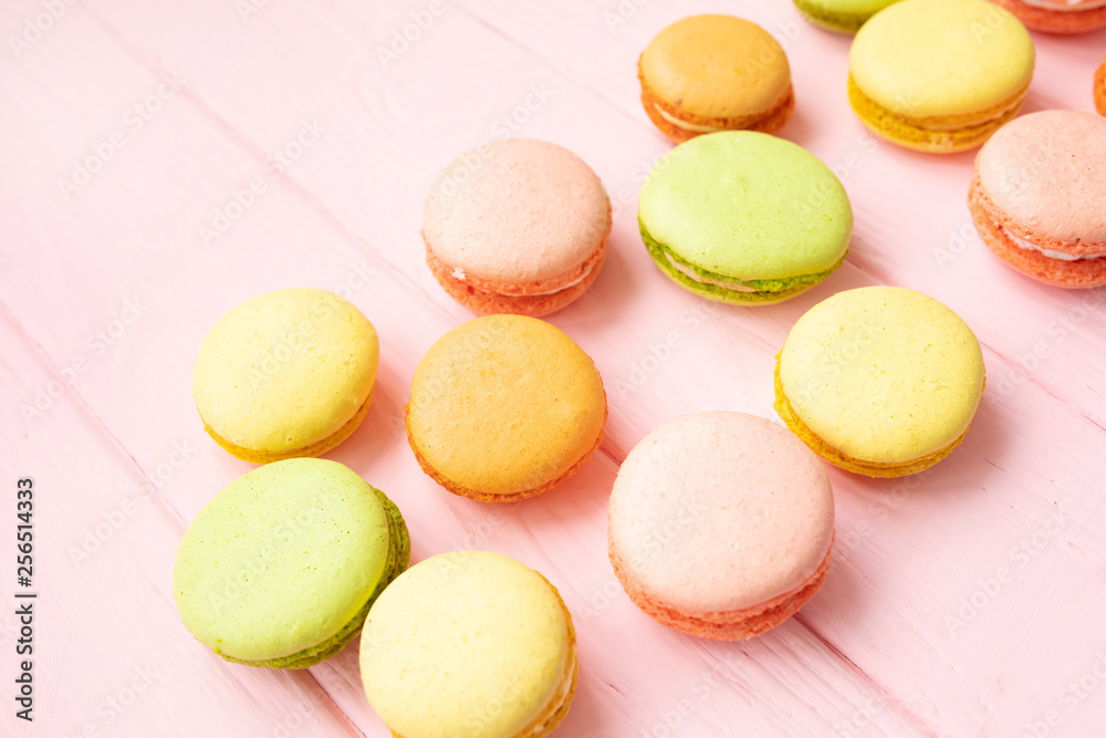 Multicolored macaroons on pink background. Multicolored macaroons on pink background.