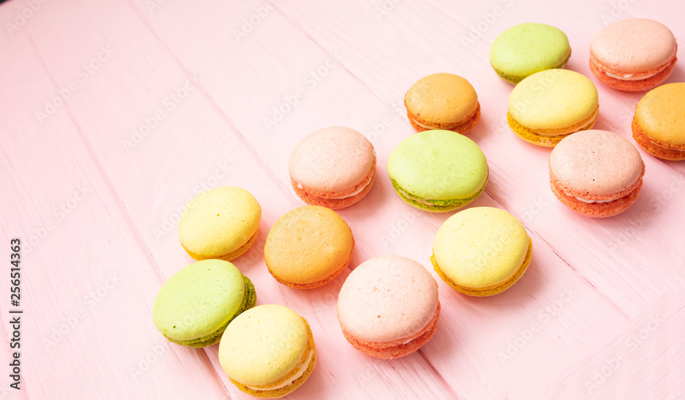 Multicolored macaroons on pink background. Multicolored macaroons on pink background.
