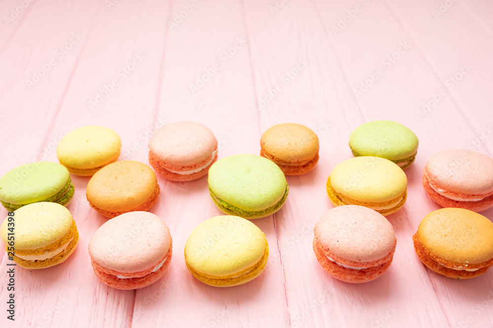 Multicolored macaroons on pink background. Multicolored macaroons on pink background.