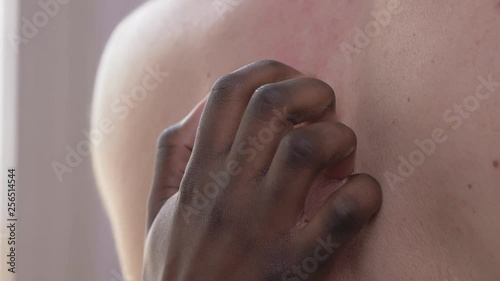 love, interracial sex concept.Black woman hand scratching back of white man