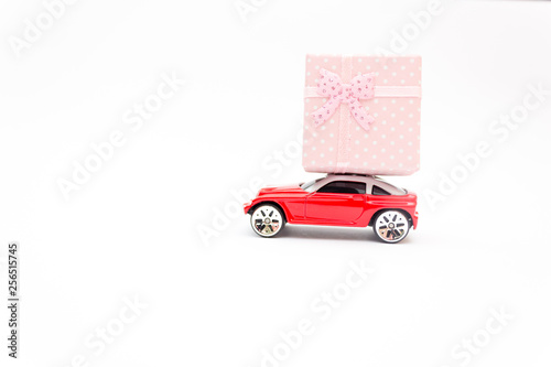 Red toy car  golden ring  marriage proposal  happiness concept