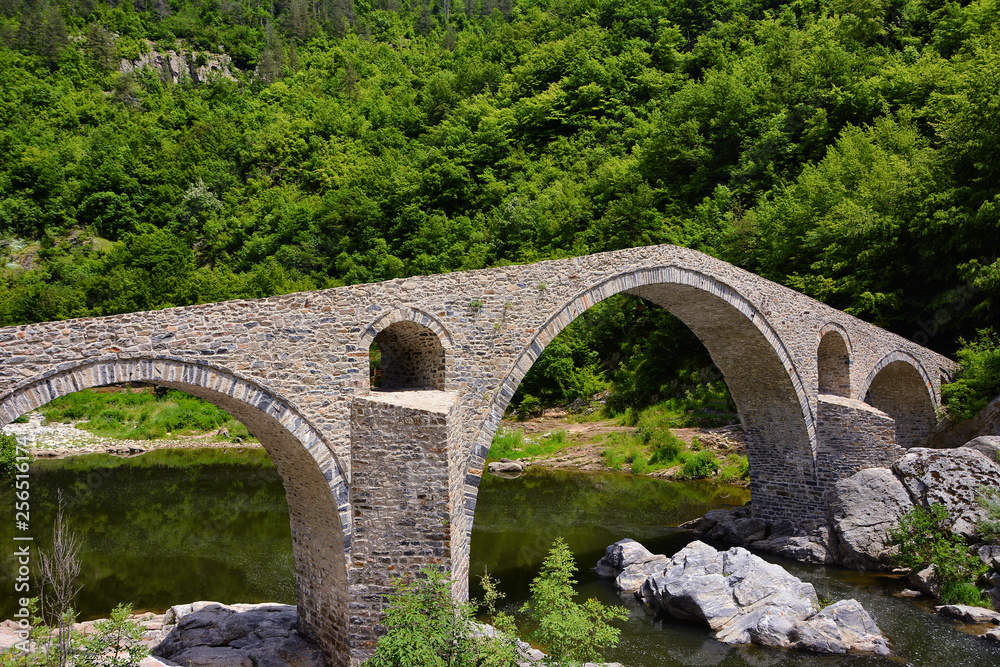 Devil's bridge, Bulgaria. Ancient stone bridge over Arda river, spring time. Rhodope mountain