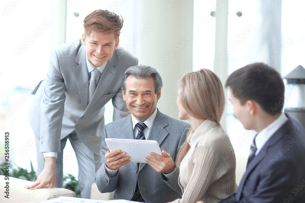 businessman uses a digital tablet to work in the office.photo with copy space businessman uses a digital tablet to work in the office.photo with copy space