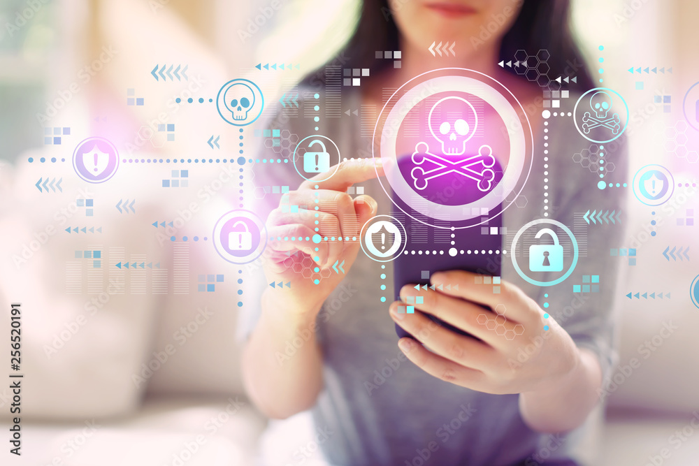 Virus and scam theme with woman using her smartphone in a living room Virus and scam theme with woman using her smartphone in a living room