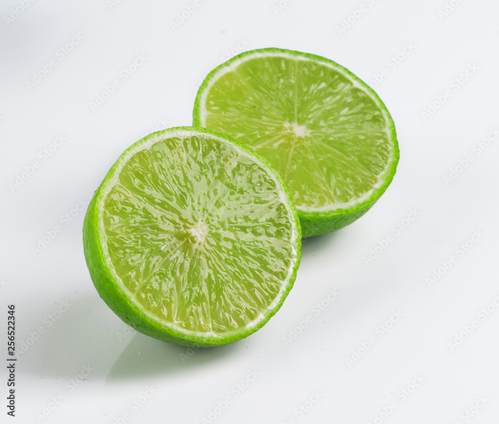 a slice of lime, isolated on white background a slice of lime, isolated on white background