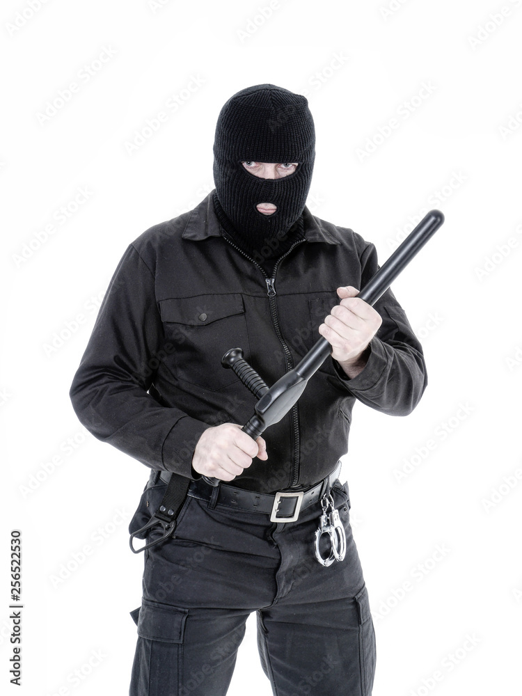 Antiterrorist policeman in black uniform and black balaclava Antiterrorist policeman in black uniform and black balaclava