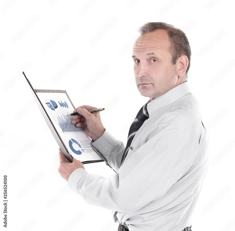 side view. the businessman checks the financial report side view. the businessman checks the financial report