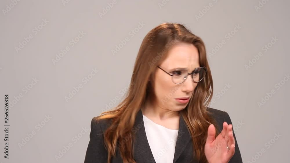 A young woman frowns at the bad smell in the room. Spoiled air. Bad smell