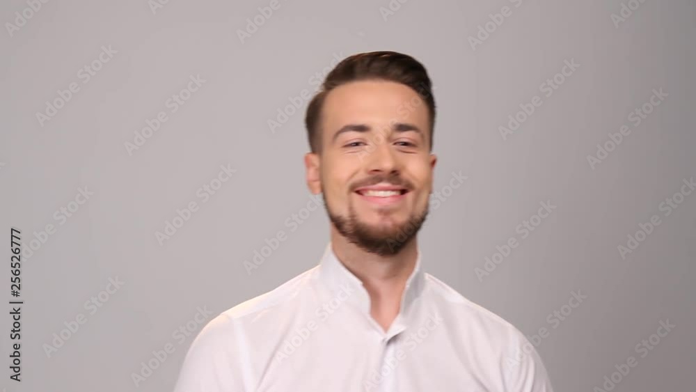 Man loking at camera and smiling. Portrait of happy fashionable handsome man Man loking at camera and smiling. Portrait of happy fashionable handsome man