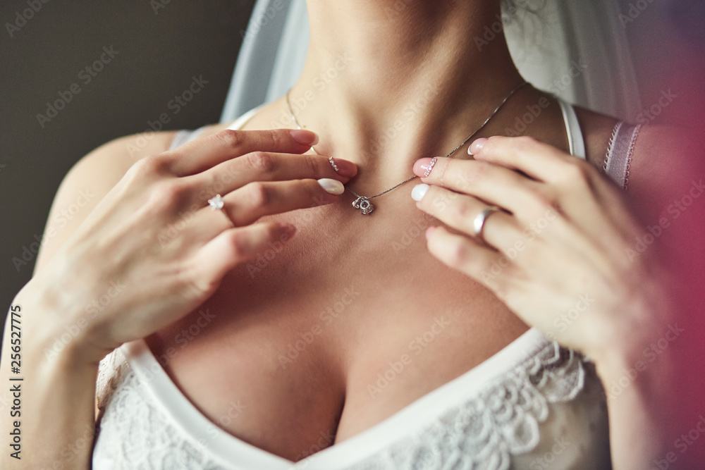 Morning of the bride when she wears a beautiful dress, woman getting ready before wedding ceremony Morning of the bride when she wears a beautiful dress, woman getting ready before wedding ceremony