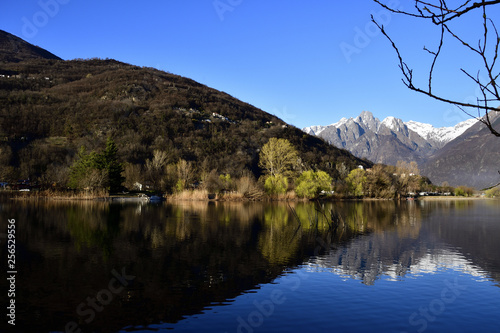 Alps relfected in Mera river before fall in the lake of Como. photo