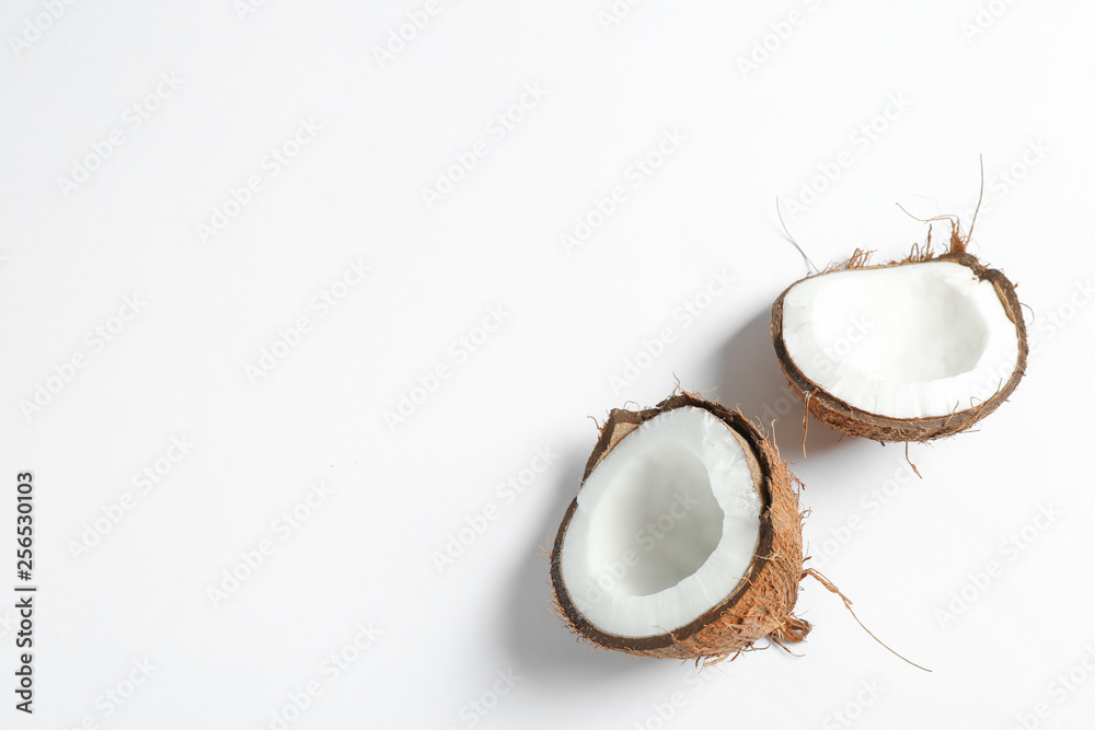Split tropical coconut isolated on white background