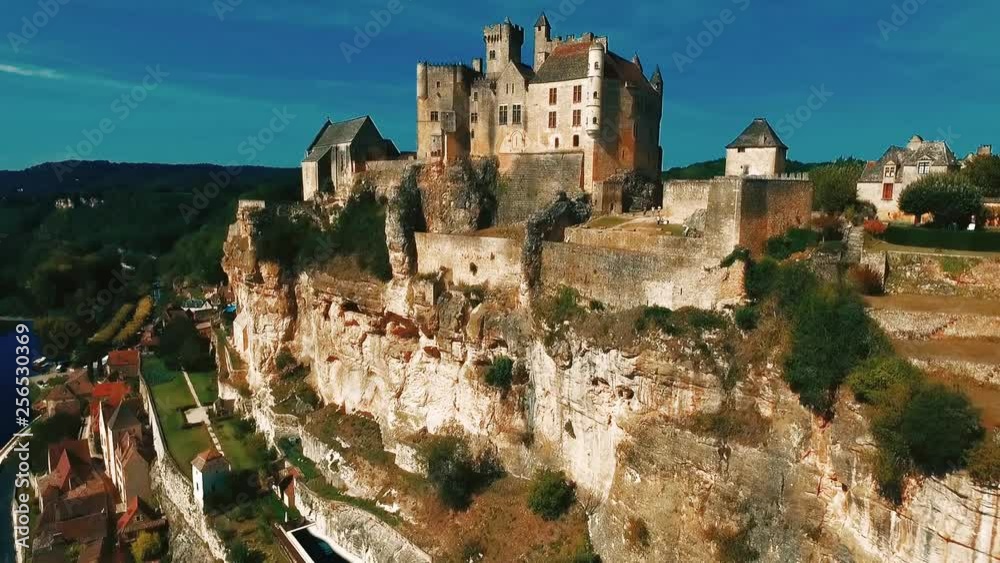Beautiful ancient castle in France. The best view of the royal castle and the river Dordogne. Beautiful village and fortress. Beautiful ancient castle in France. The best view of the royal castle and the river Dordogne. Beautiful village and fortress.