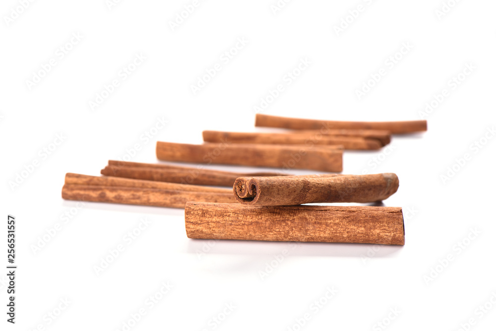 Soft focus. A few cinnamon sticks isolated on white background. Spice concept