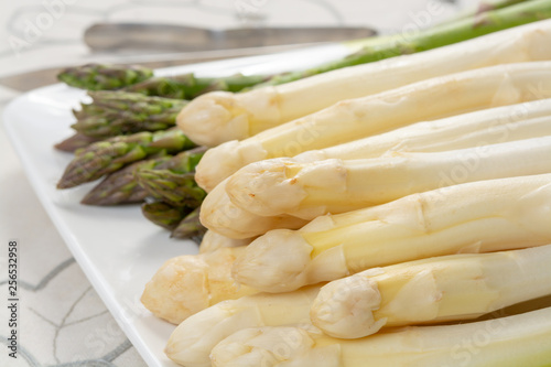 New harvest of white and green asparagus vegetable in spring season, washed asparagus ready to cook, spring menu for restaurants