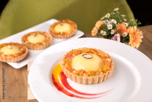 Homemade exotic tart - passion fruit ganache, lime curd, exotic marmalade, coconut biscuits.