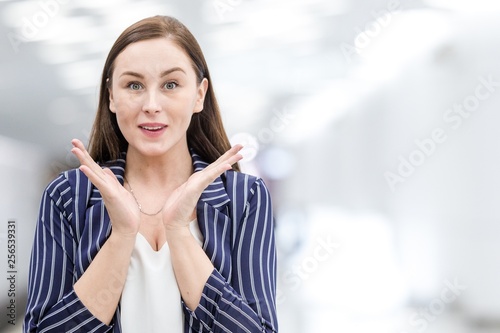 Portrait of a happy woman holding her hands to her face in surprise. Providing discounts in stores Free Download Portrait of a happy woman holding her hands to her face in surprise. Providing discounts in stores - GFXLoad