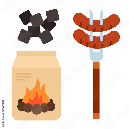 Sausages on a meat fork with charcoal in the package flat isolated