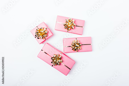 Fototapeta Naklejka Na Ścianę i Meble -  Flat lay composition of bright pink packaged gifts