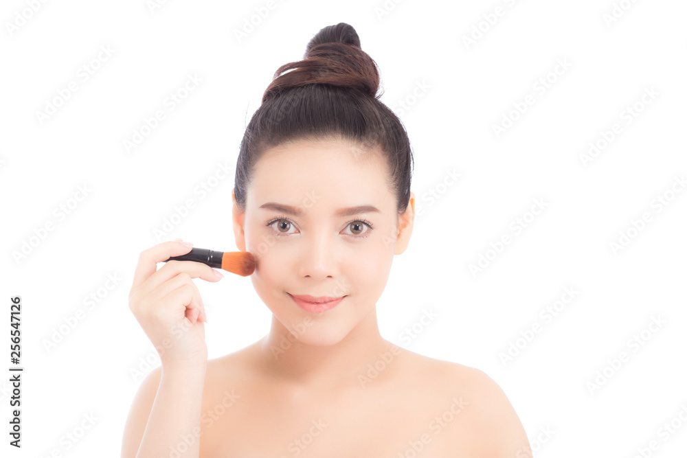 Beauty of portrait asian woman applying make up with brush of cheek isolated on white background, beautiful of girl holding blusher, skincare and cosmetic concept.