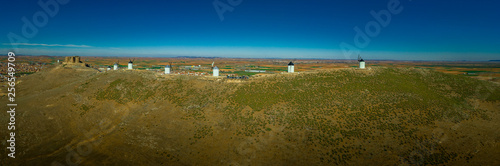 Consuegra castle and windmills aerial view with blue sky in La Mancha Spain famous Don Quixote site