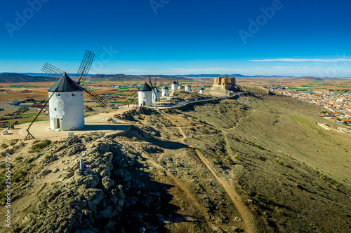 Consuegra castle and windmills aerial view with blue sky in La Mancha Spain famous Don Quixote site