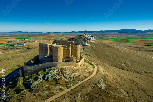 Consuegra castle and windmills aerial view with blue sky in La Mancha Spain famous Don Quixote site