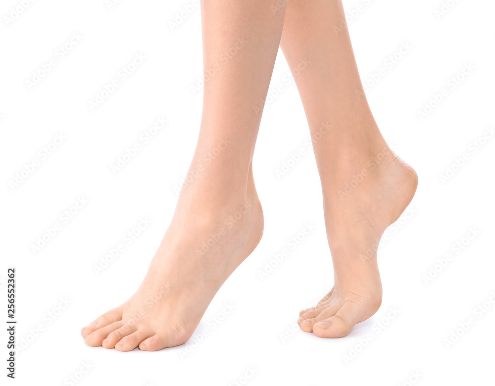 Young woman with perfect smooth skin on white background, closeup of feet. Beauty and body care