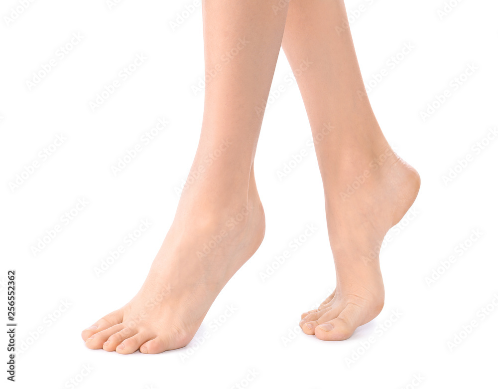 Young woman with perfect smooth skin on white background, closeup of feet. Beauty and body care Young woman with perfect smooth skin on white background, closeup of feet. Beauty and body care