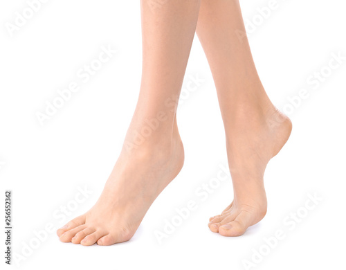 Young woman with perfect smooth skin on white background, closeup of feet. Beauty and body care © New Africa