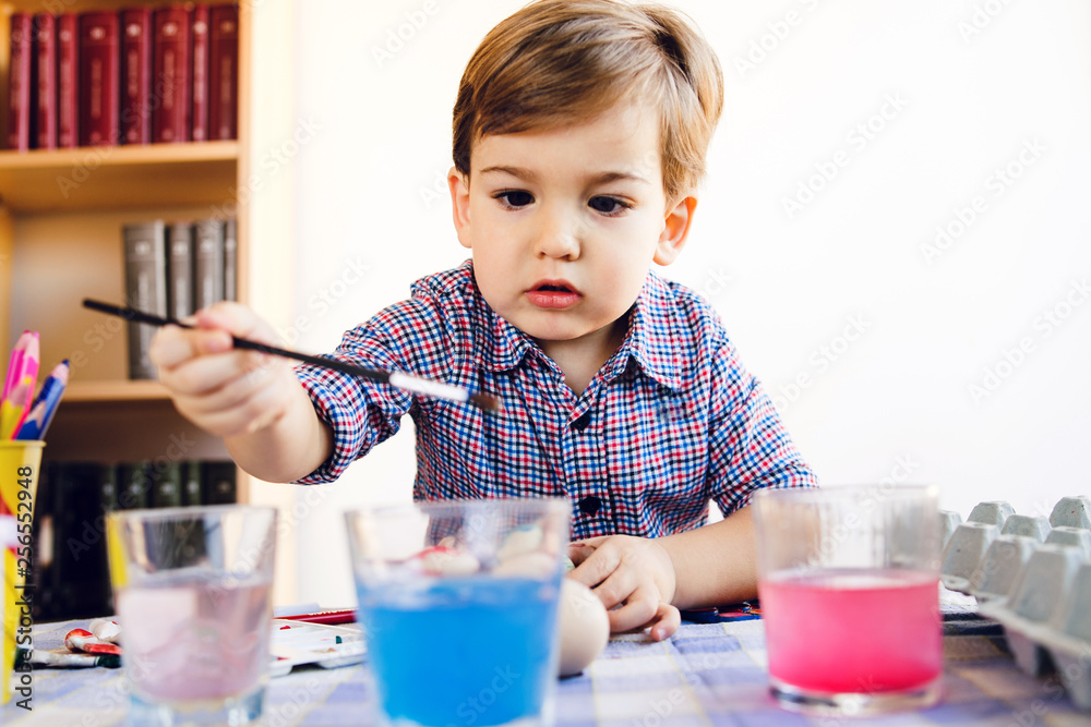Little Boy Painting water color Easter Eggs At Home Little Boy Painting water color Easter Eggs At Home