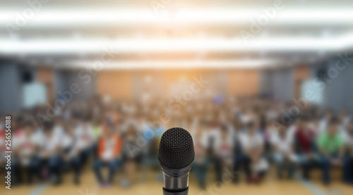 Fotografie, Tablou Microphone over the Abstract blurred photo of conference hall or seminar room wi