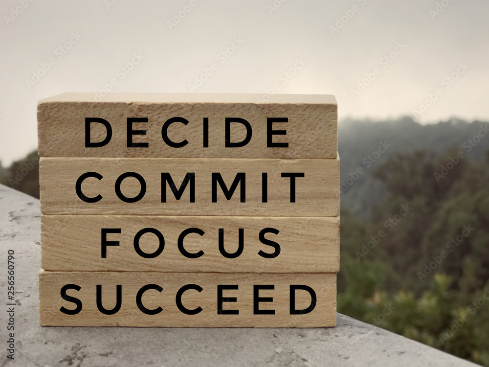 Fotografie Motivational and inspirational words - Decide, Commit, Focus,Succeed written on wooden rectangular blocks