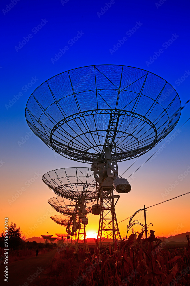 The silhouette of a radio telescope observatory The silhouette of a radio telescope observatory
