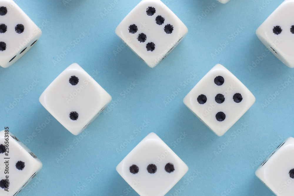 White gaming dices on light blue background. victory chance and lucky. Flat lay style, place for text. Top view and Close-up cube. Concept business, gamble and game. Spectacular background pastel. White gaming dices on light blue background. victory chance and lucky. Flat lay style, place for text. Top view and Close-up cube. Concept business, gamble and game. Spectacular background pastel.