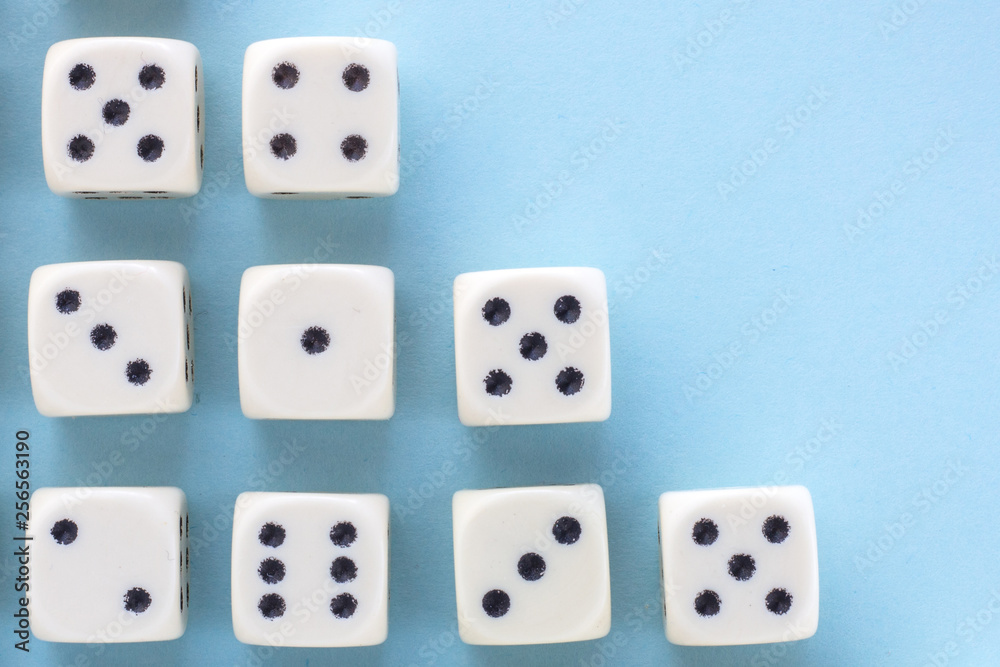 White gaming dices on light blue background. victory chance and lucky. Flat lay style, place for text. Top view and Close-up cube. Concept business, gamble and game. Spectacular background pastel. White gaming dices on light blue background. victory chance and lucky. Flat lay style, place for text. Top view and Close-up cube. Concept business, gamble and game. Spectacular background pastel.