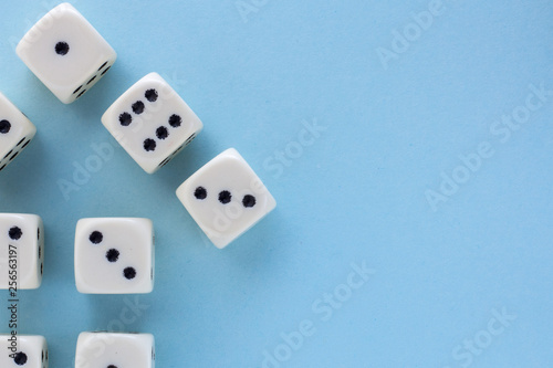 Arrow up. White gaming dices on light blue background. victory chance and lucky. Flat lay style  place for text. Top view and Close-up cube. Concept business and game. Spectacular background pastel.
