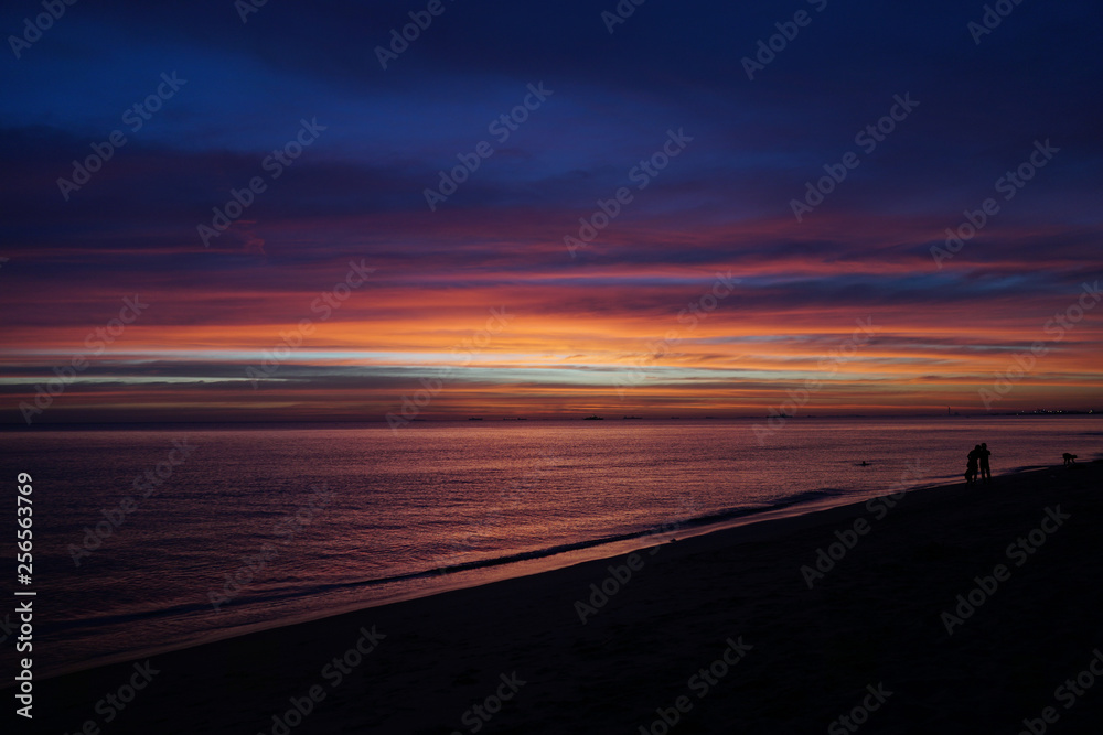 Tropical sunset on the beach. Lham Maepim island, Rayong, Thailand. Red sunset before big storm PABUK.