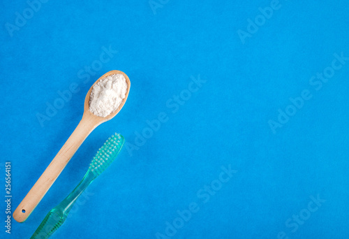 Toothbrush and baking soda to clean - Text space