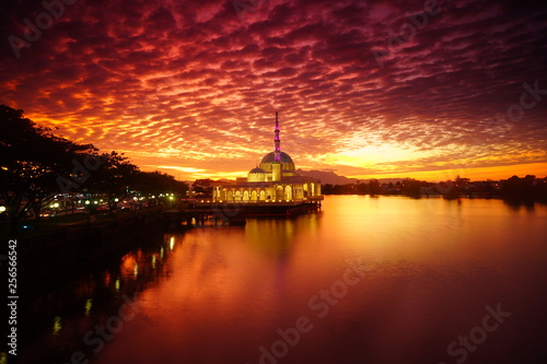 wonderful sunset with islamic mosque and bridge at kuching sarawak © hashim