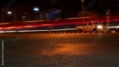 Car lights with paved roads at night. © kaentian
