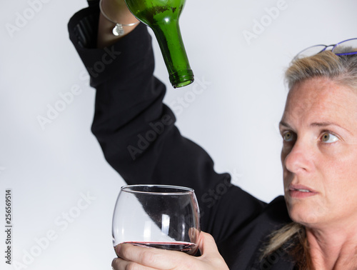 woman is upset that the wine is alll gone photo