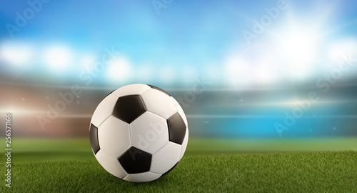 a soccer ball on a soccer field in front of a blurred soccer stadium flood lights 3d-illustration © wetzkaz