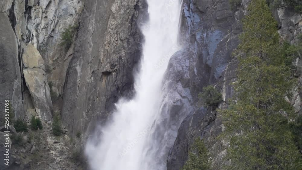 Slow motion pan up shot of lower Yosemite falls in early spring Slow motion pan up shot of lower Yosemite falls in early spring